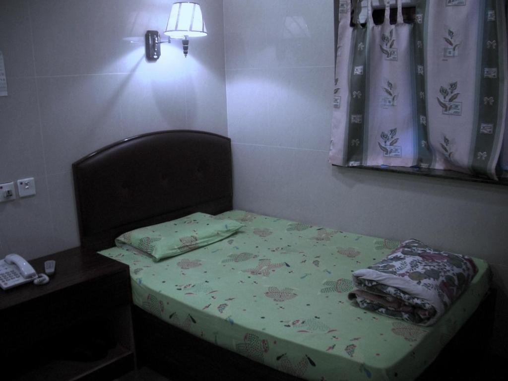 Kowloon Youth Village Tsim Sha Tsui 九龙青年公寓 Hongkong Szoba fotó